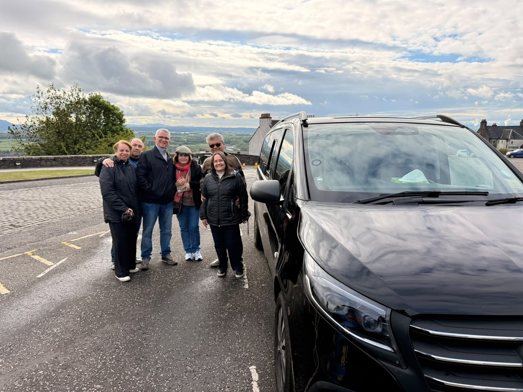 City Wheels customers with their chauffeur-driven Mercedes V-Class near Stirling, Scotland