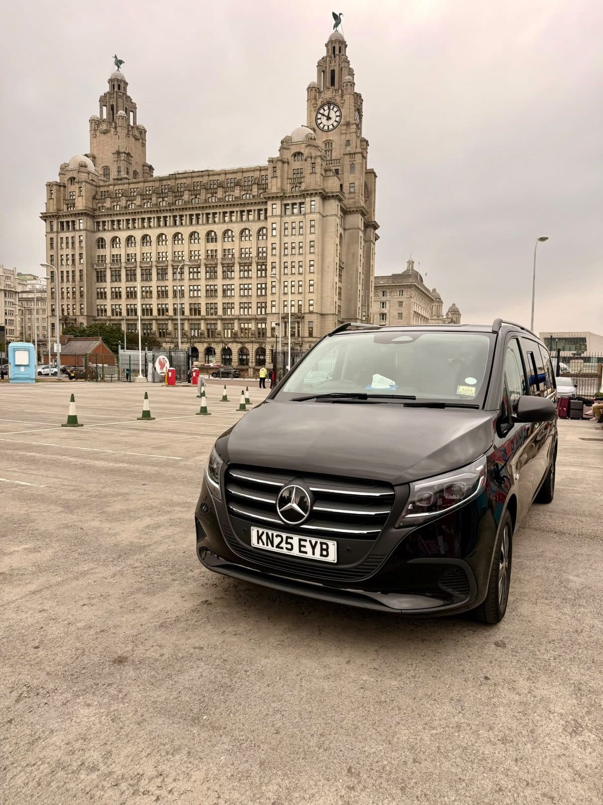 City Wheels vehicle at Liverpool's Liver Building with luggage